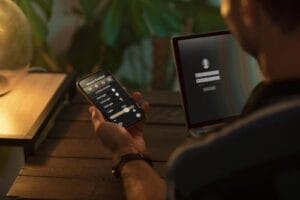 person-using-smartphone-his-automated-home-min