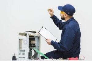 sideways-man-repairing-computer-min