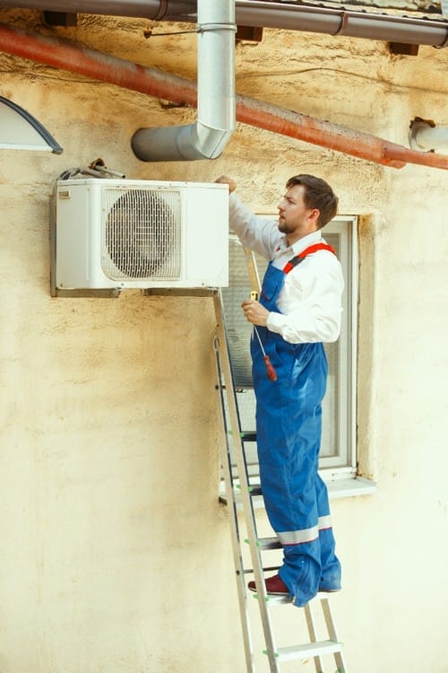 technician working on condensing unit